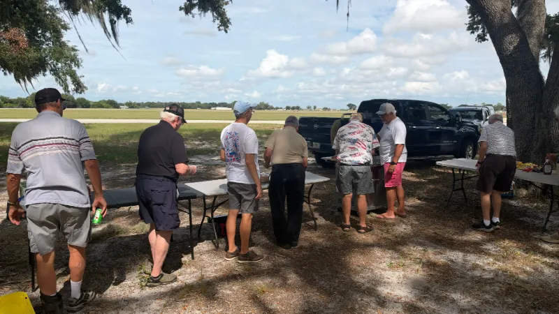 Members lining up for hotdogs